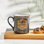 Црна шолја со златен натпис Coffee и геометриска шара